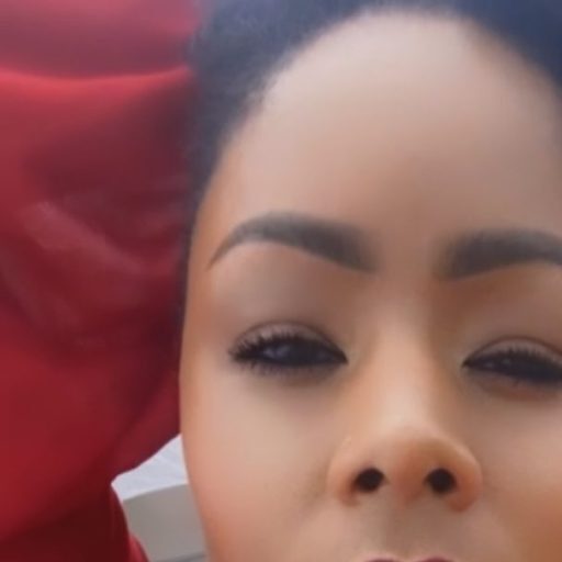 Close-up of a woman's face with well-groomed eyebrows and smooth skin.